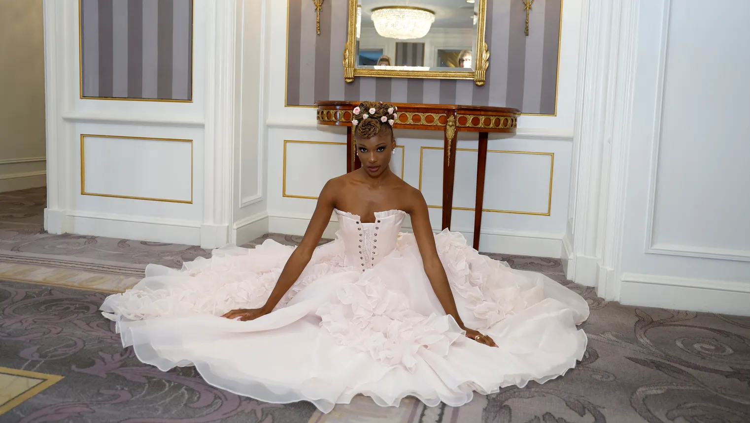 A model poses in a Selkie spring-summer 2024 pink corset dress with a full pink during New York Fashion Week.