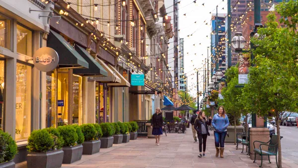 A street lined with restaurants and shops.