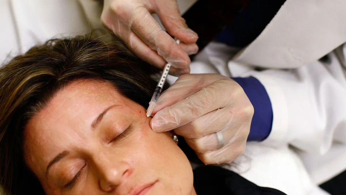 ARLINGTON, VA - JUNE 05: Recently laid off worker Lyn Talent receives a free Botox injection during an event called the "The Botox Bailout."