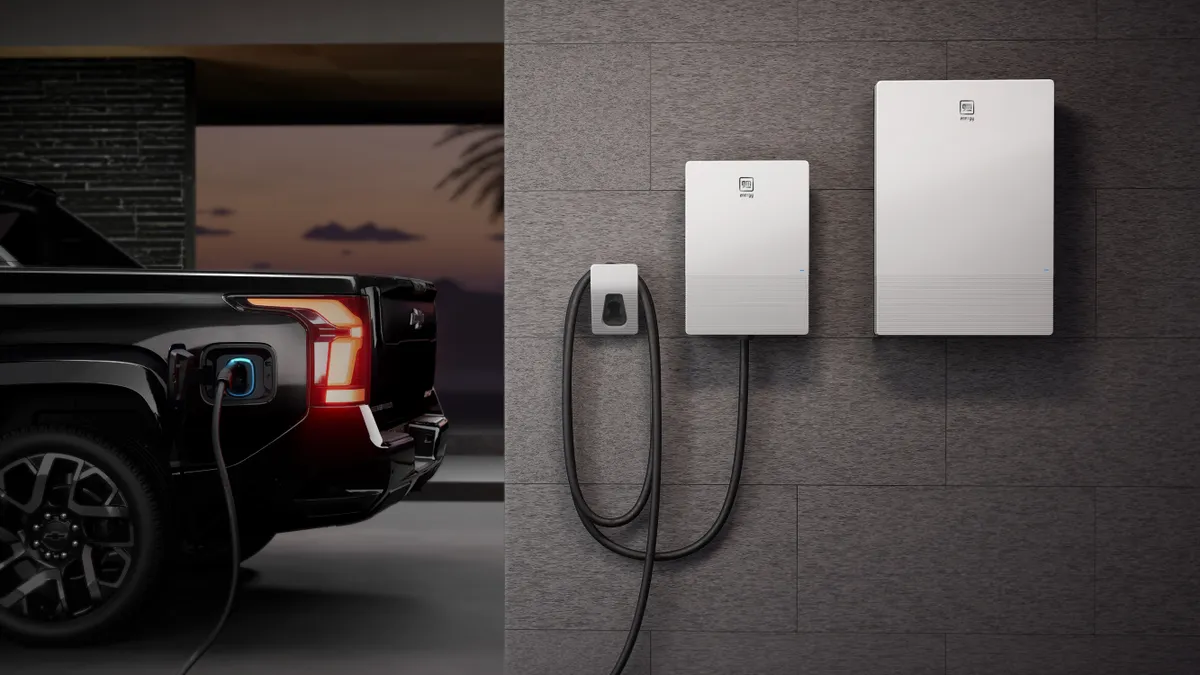 A rendering of a 2024 Chevrolet Silverado EV in a residential garage with GM's vehicle-to-home charging equipment mounted on the wall.