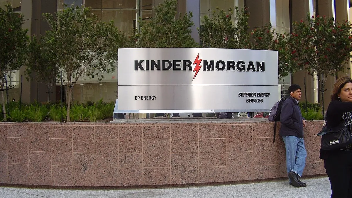 Large "Kinder Morgan" sign outside an office building