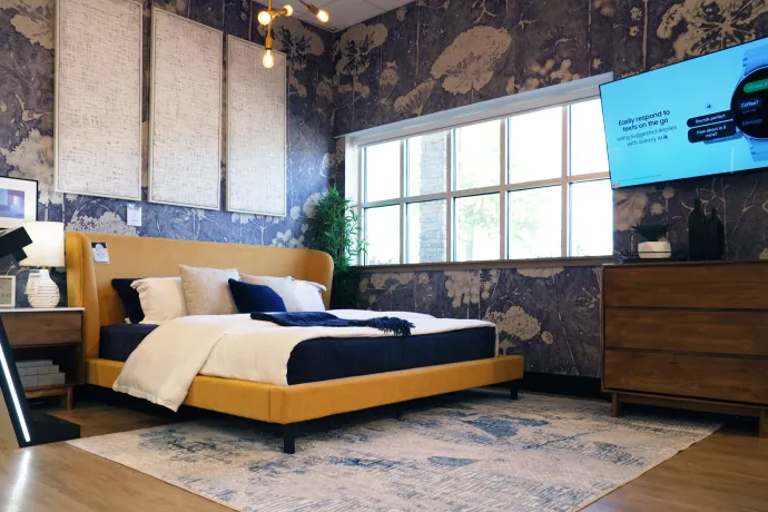 A bedroom featuring Ashley and its partnership with Samsung.