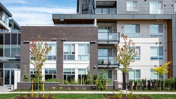 Modern apartment building on sunny day.