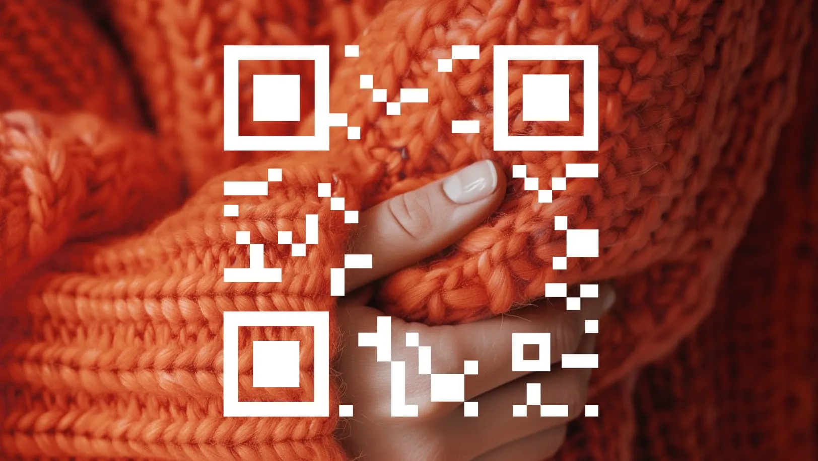 An orange sweater with an overlay of a QR code