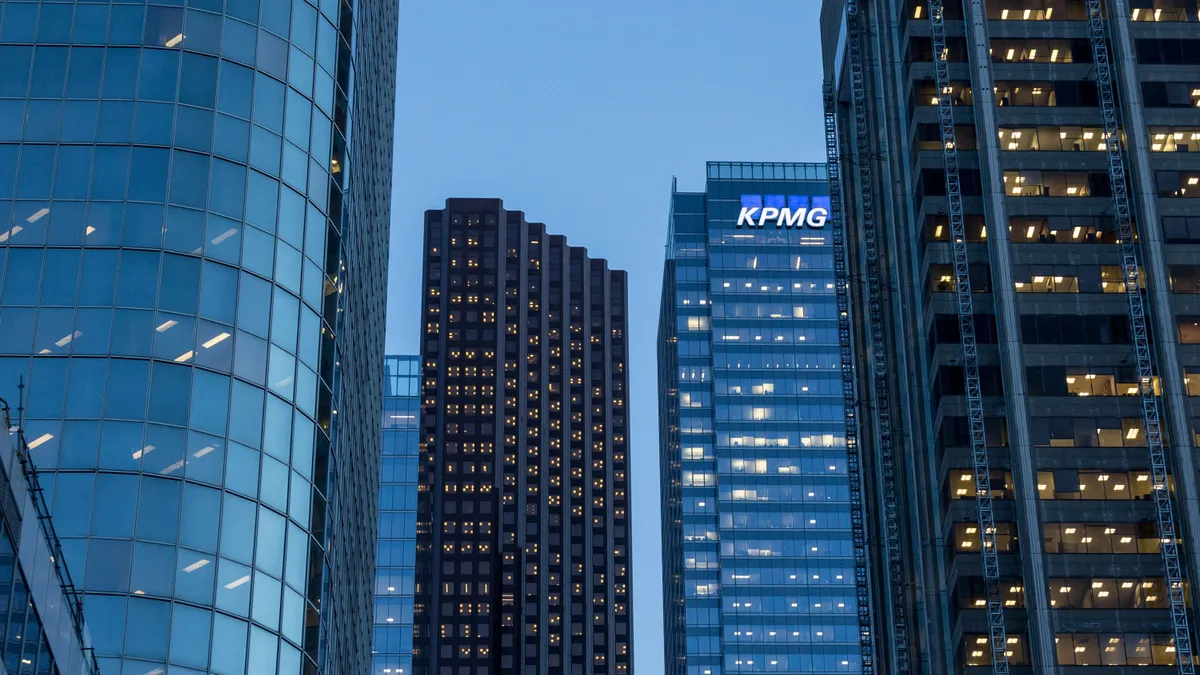 KPMG logo on a skyscraper at night in Toronto CBD, Ontario, Canada.