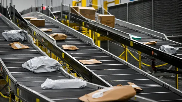 Packages move down a conveyor belt at an Amazon same-day delivery facility in Orlando, Florida, on Dec. 2, 2024.