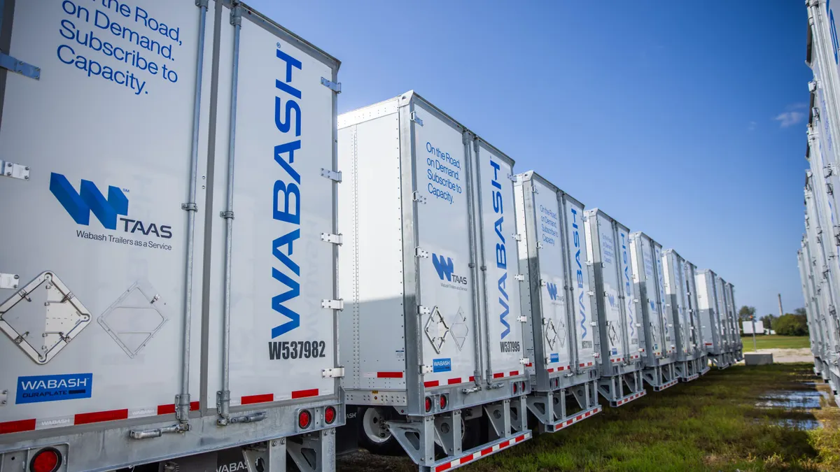 A row of trailers with the Wabash logo.