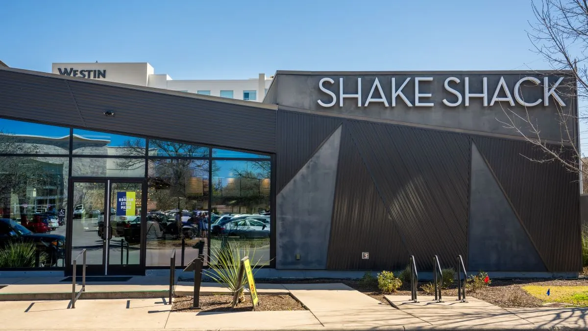 An image of a gray building with a white logo that says "Shake Shack"