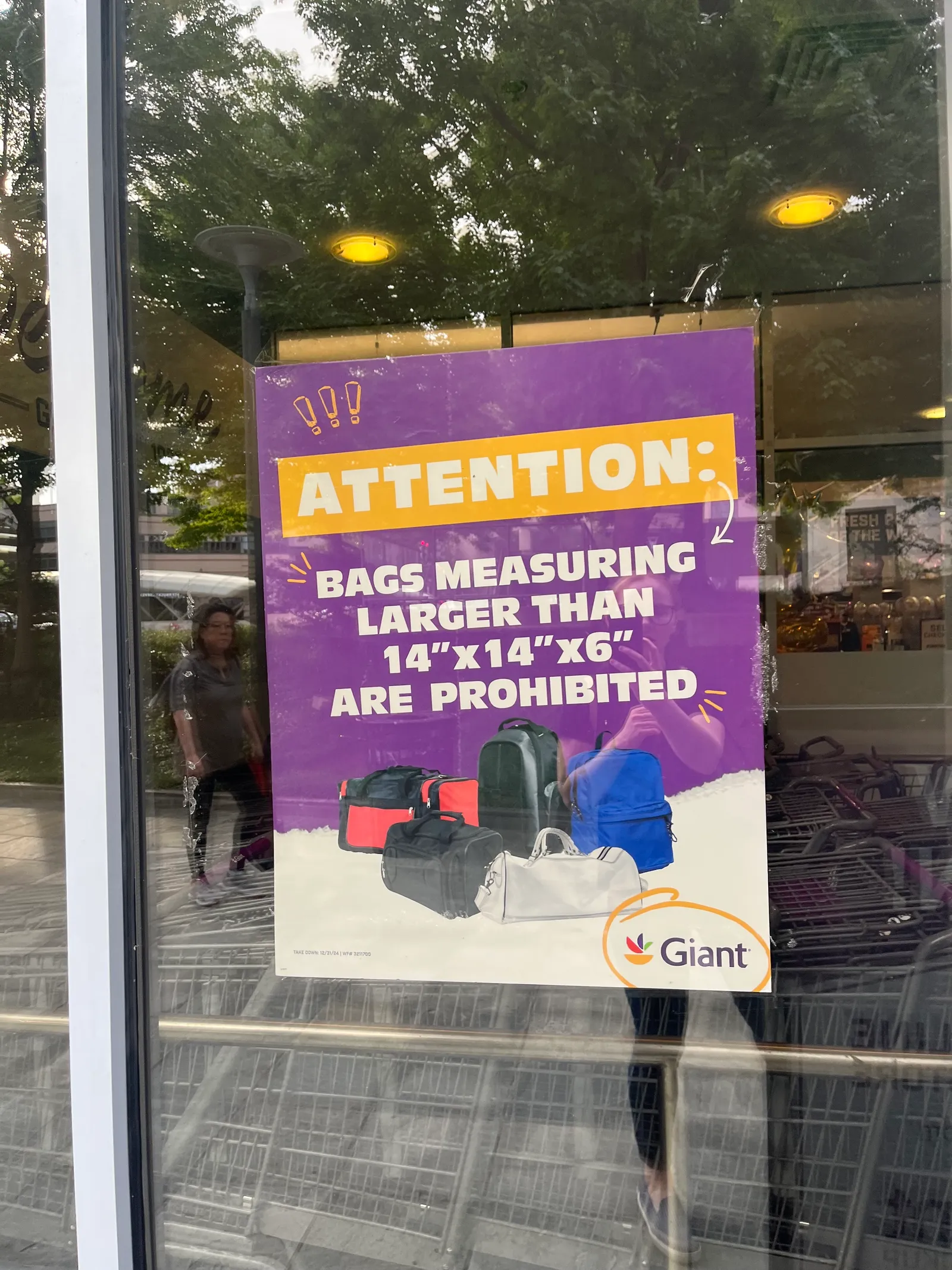 Sign in the window of a Washington, D.C., Giant Food store that reads &quot;Attention: Bags measuring larger than 14” x 14” x 6&quot; are prohibited.&quot;