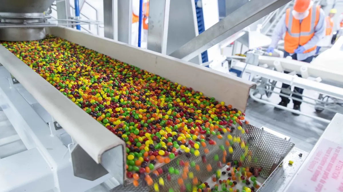 Skittles roll off a production line at a Mars Wrigley factory in Yorkville, Illinois.