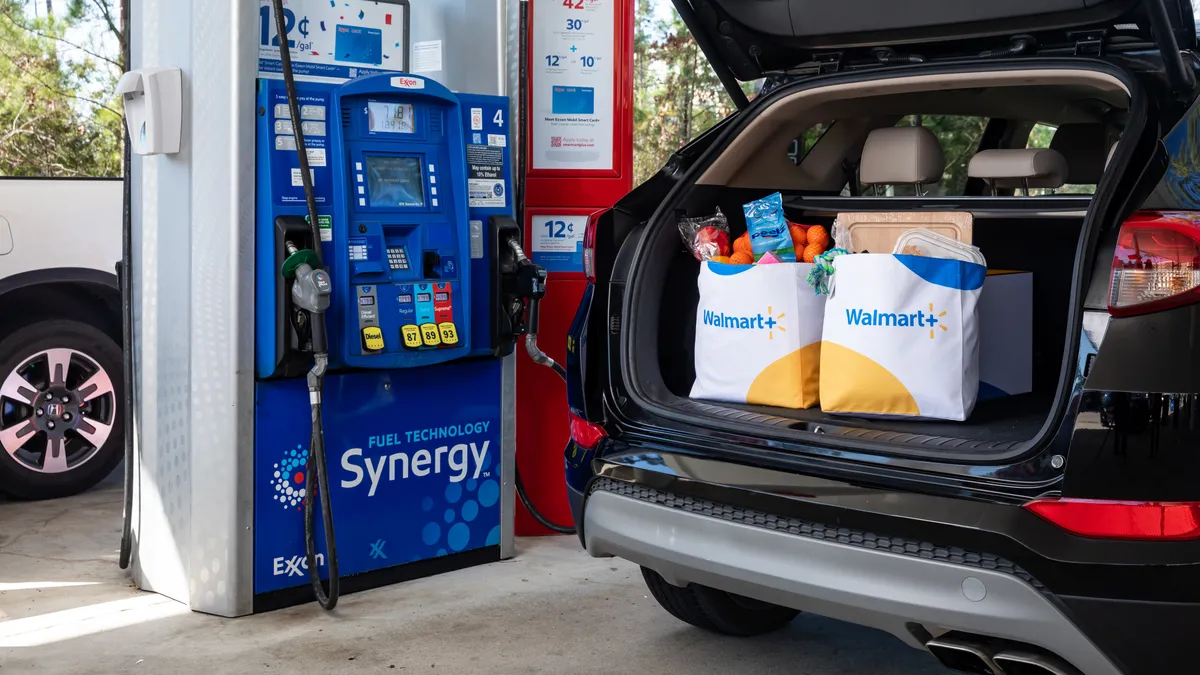 Grocery bags in a car trunk.