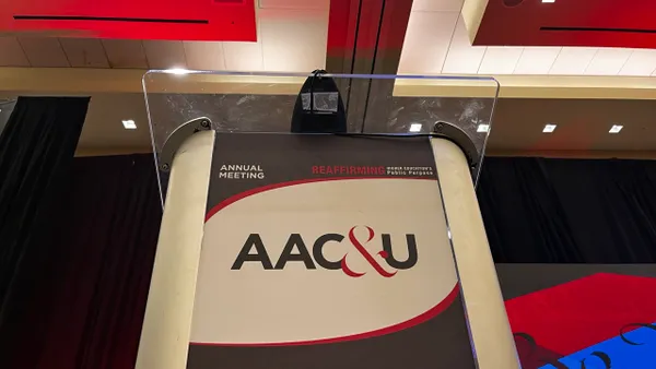 A podium that reads "AAC&U"