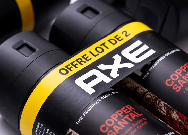 Two Axe deodorant cans bundled together with a fiber band.