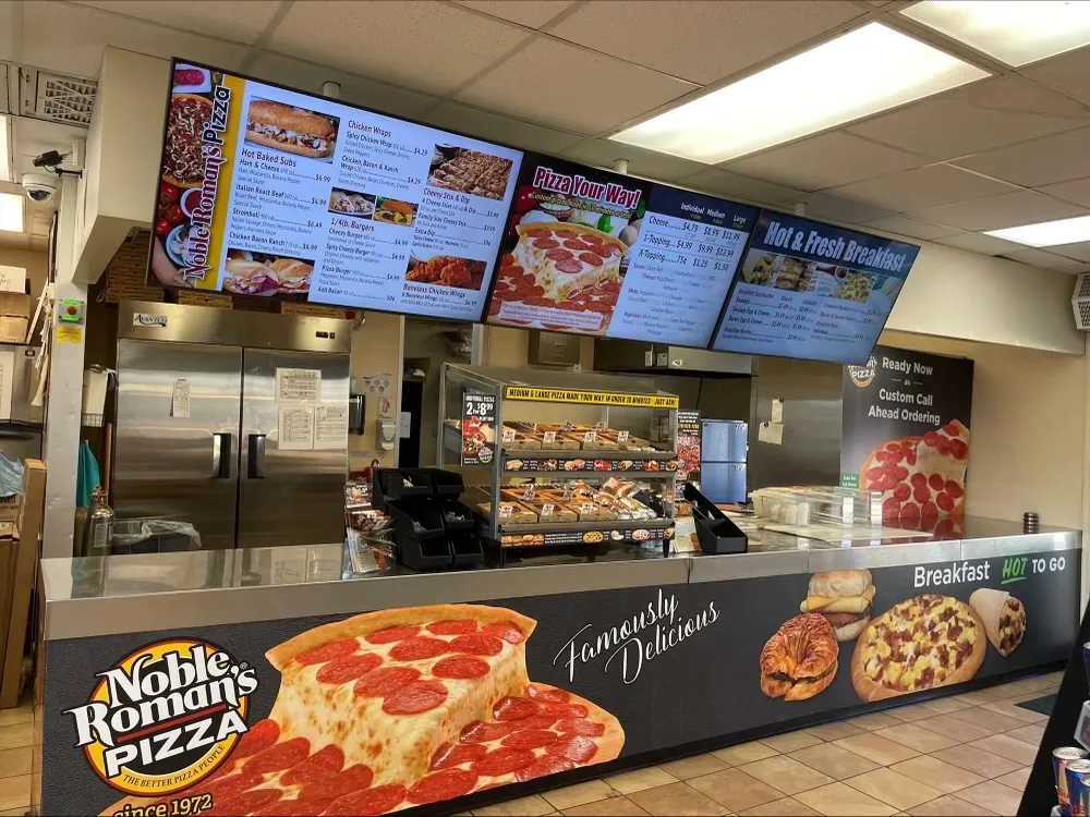 A photo of a Noble Roman&#x27;s pizza restaurant inside a MAPCO store.