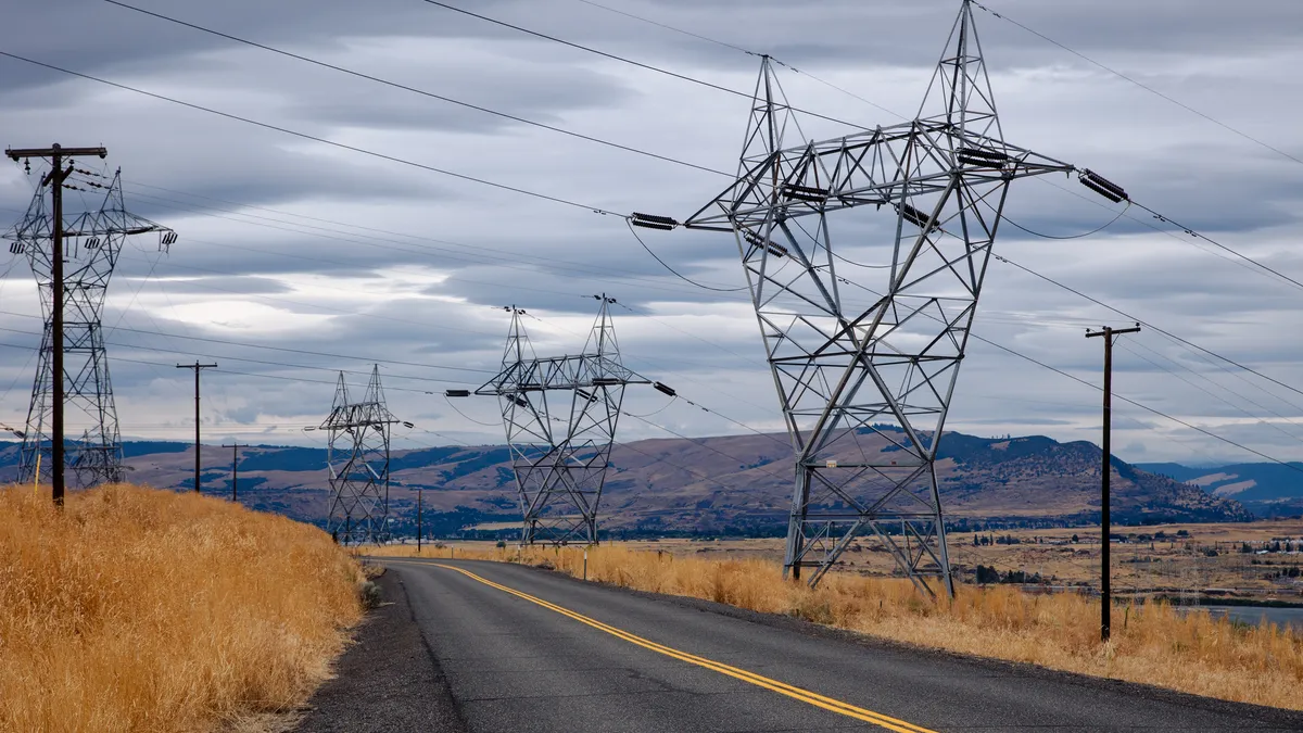 Electric transmission lines crossing a road.