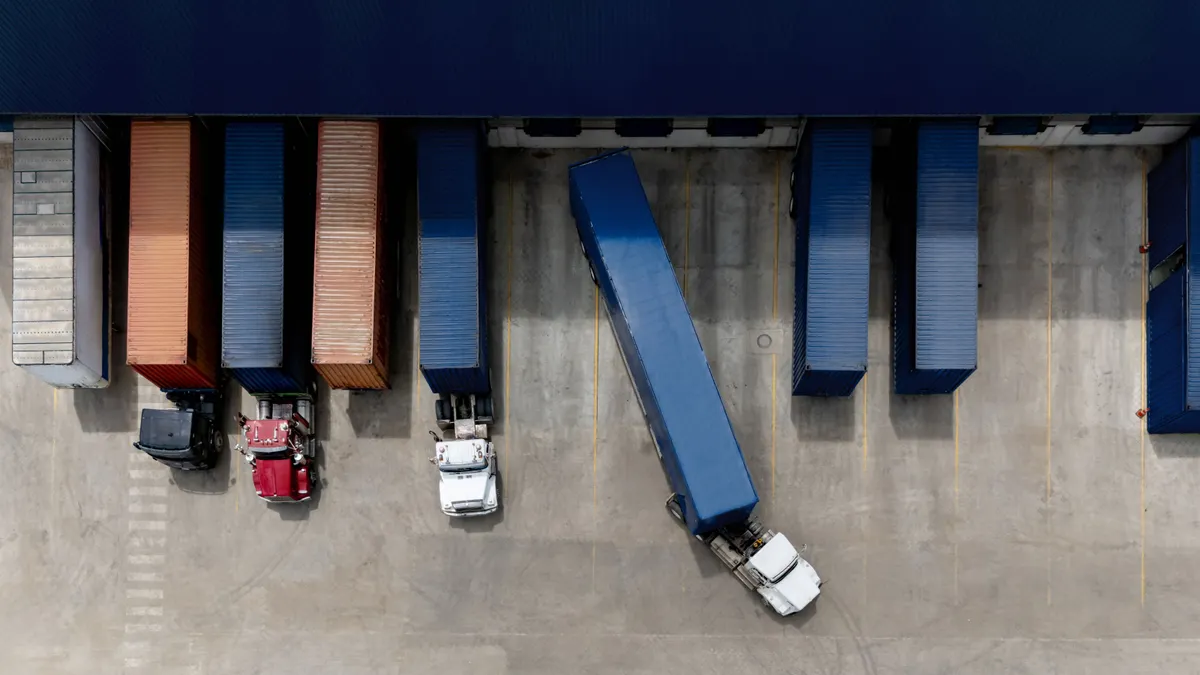 Aerial view of a truck leaving the loading dock at a distribution warehouse