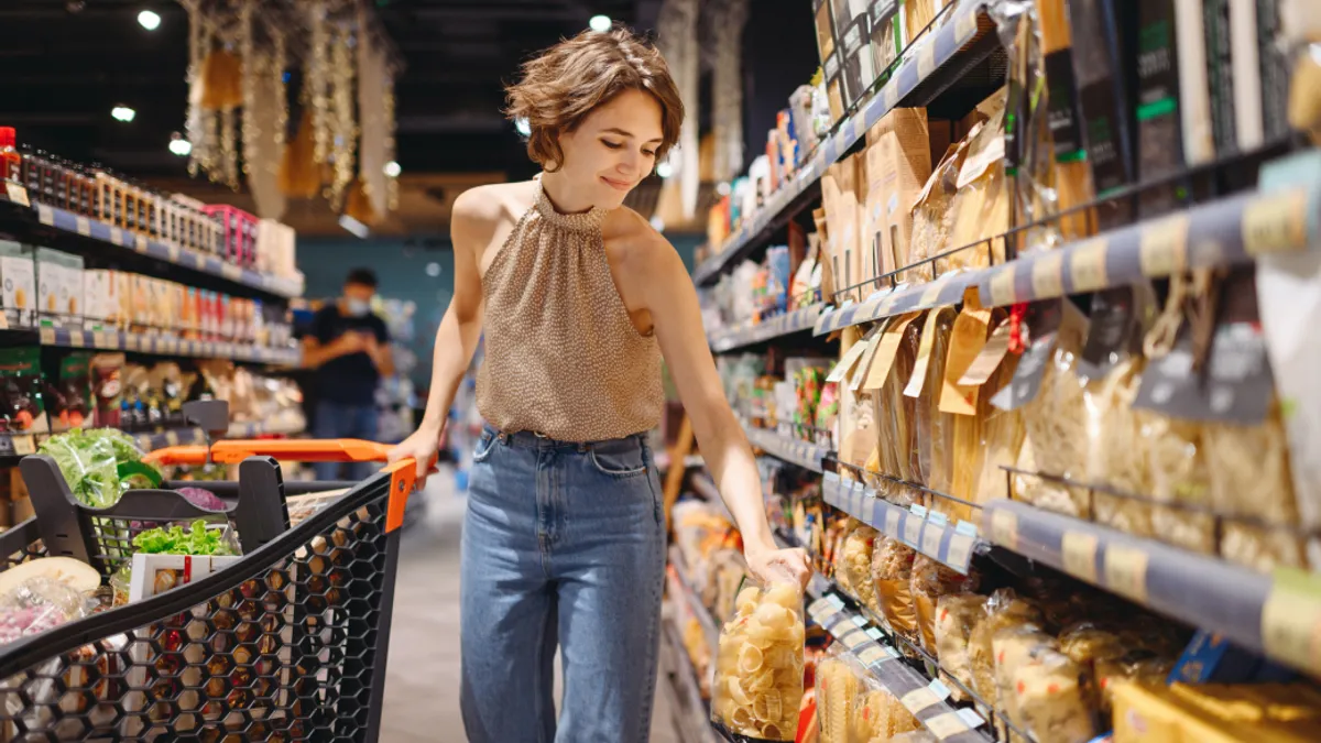 Woman shopping in grocery store isle