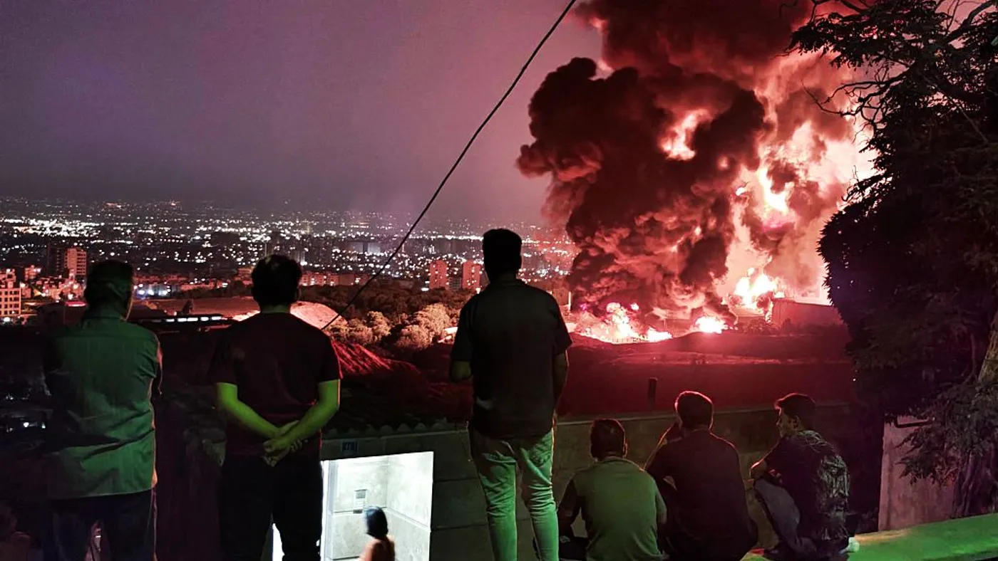 Fire and smoke arise after an attack on the Shahran oil depot in Tehran, Iran on June 15, 2025.