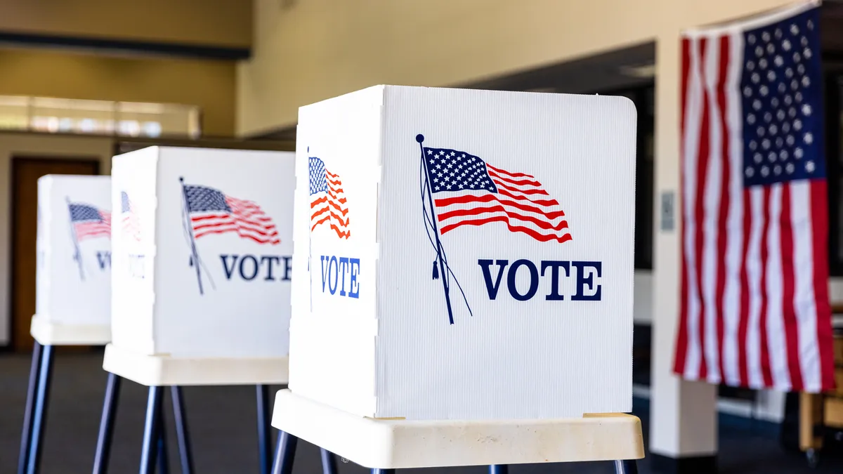 A creative image depicting empty voting booths on election day.