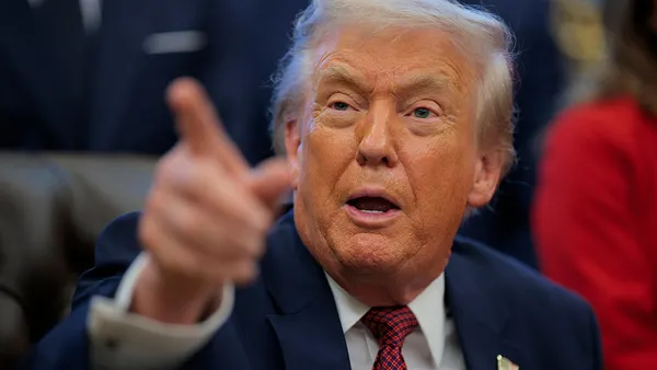 A closeup of President Donald Trump pointing