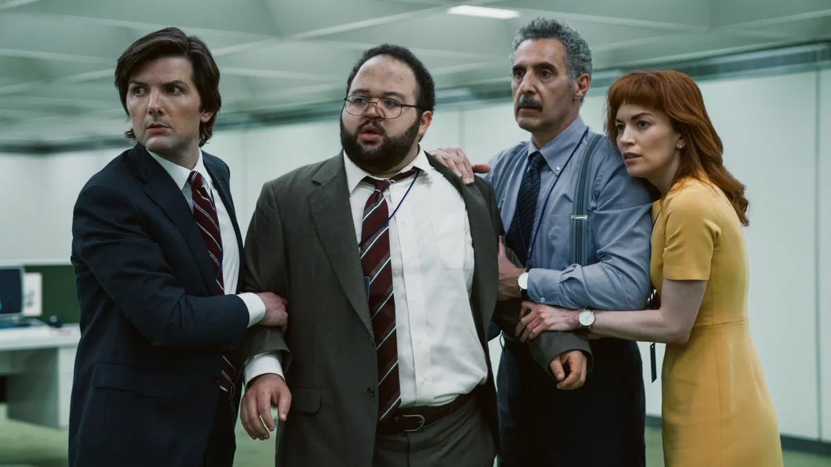 The severed workers of Lumon, featured company of hit show Severance, stand in the office.