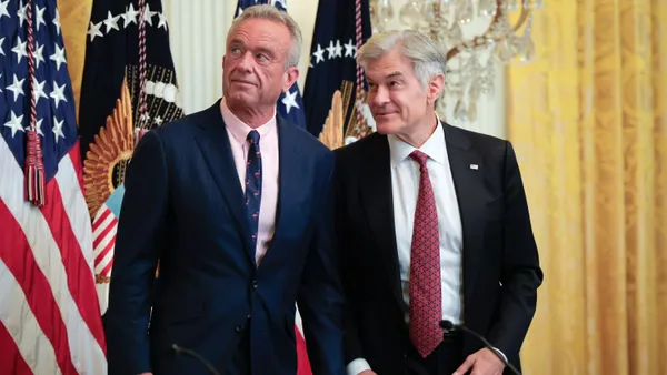 HHS Secretary Robert F. Kennedy Jr. and CMS Administrator Dr. Mehmet Oz confer before an event on health technology in the East Room of the White House on July 30, 2025, in Washington, DC.