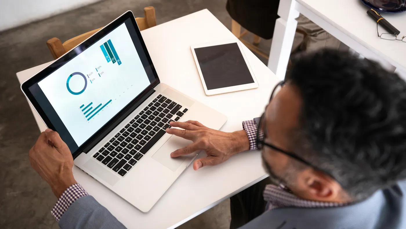 a close up of a business person looking at a chart