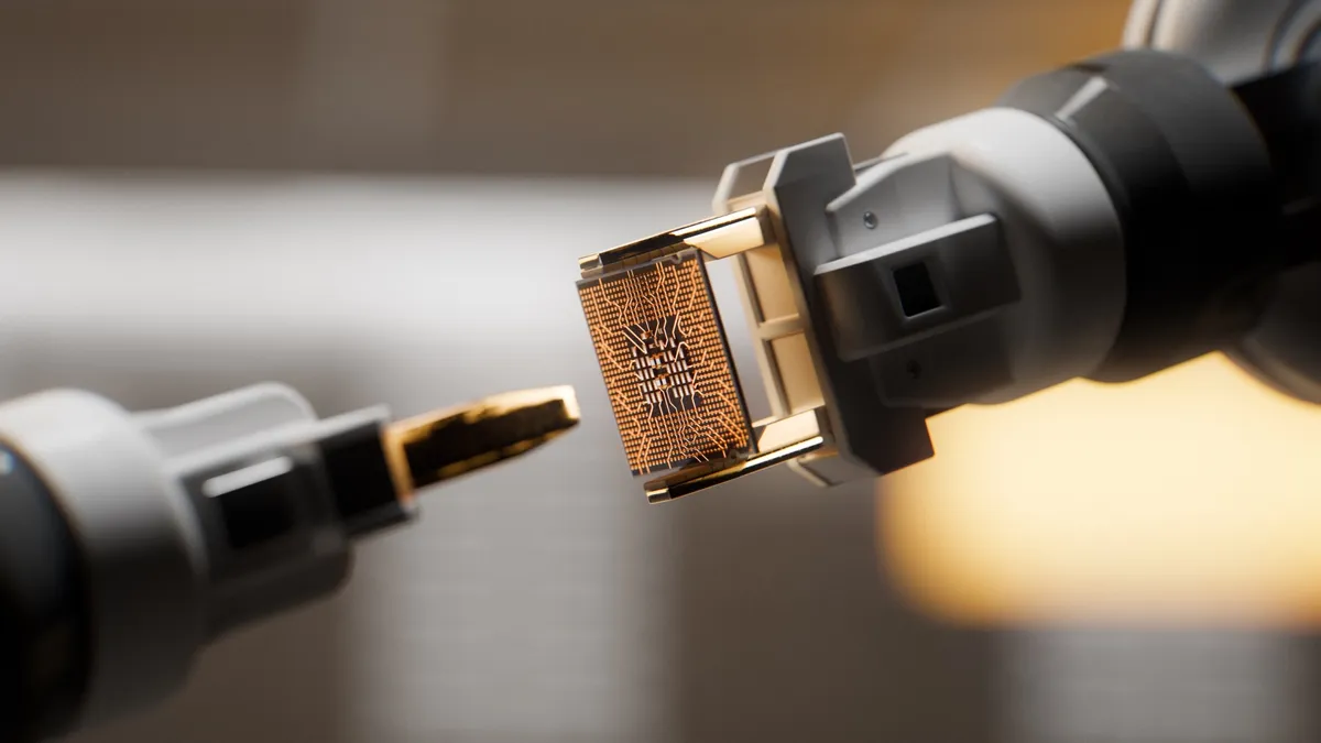 An automated robotic arm is gripping a CPU inside of a circuit board factory.