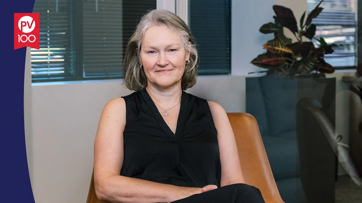 A portrait of Dr. Helen Thackray framed with a banner icon that reads "PV 100"