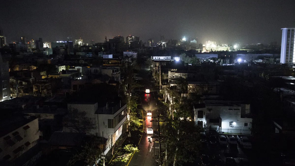 Image shows a darkened street in Puerto Rico, after Hurricane Maria knocked out the island's power.