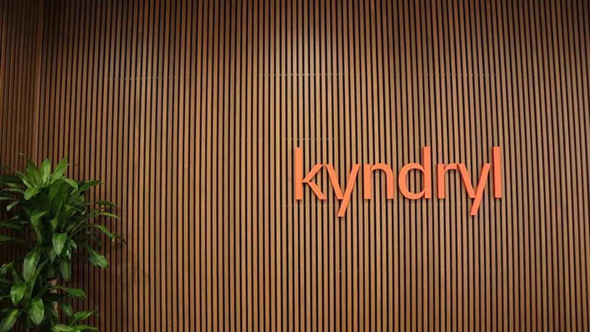 Kyndryl logo pictured on a wall inside the infrastructure services company's building.