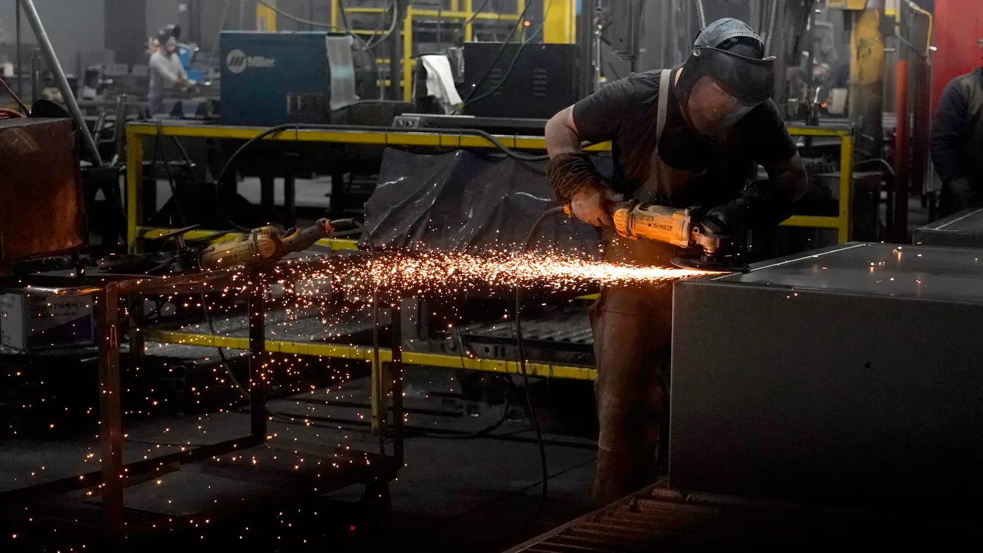 A worker grinds a weld on a safe that is being manufactured at Liberty Safe Company on March 22, 2022 in Payson, Utah.