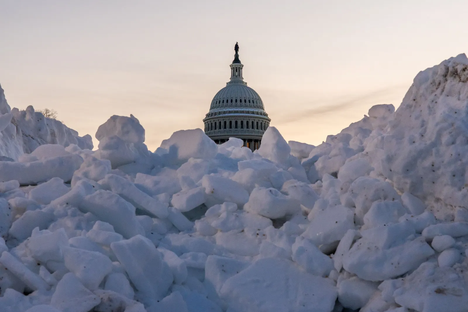 The United States Capitol surrounded by snow.