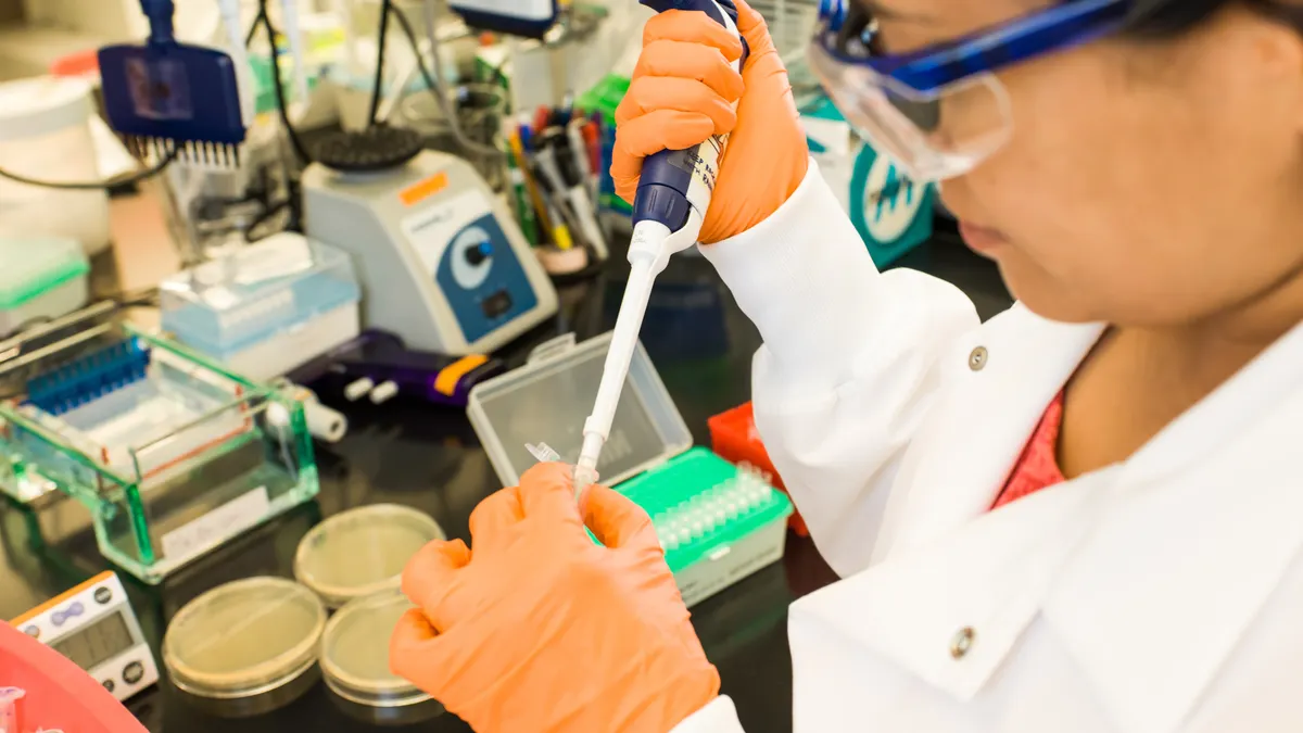 A photo of an Editas Medicine scientist in the lab.