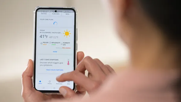 women using health app on phone