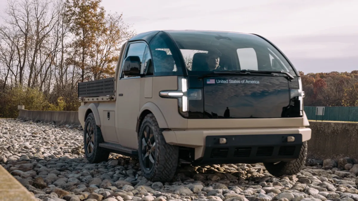 Canoo's LTV situated on a gravel road.