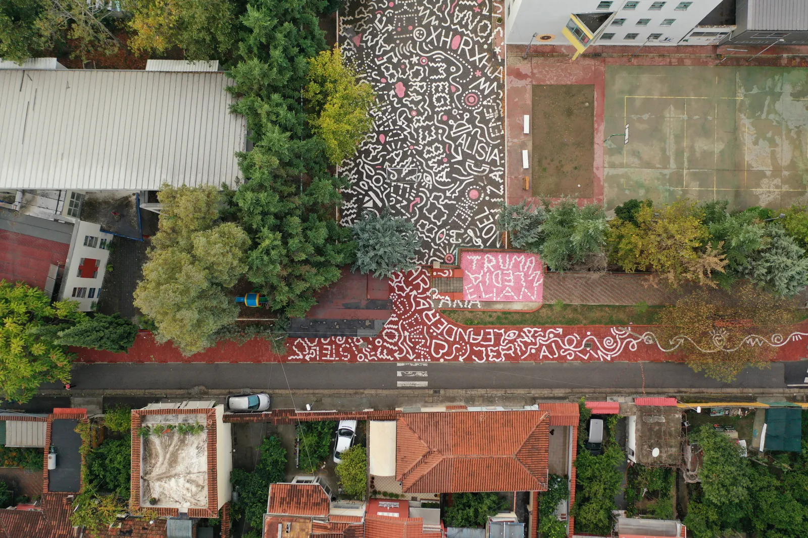 Aerial shot of asphalt painted with designs