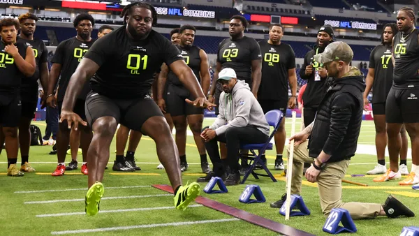 NFL Combine participants complete the broad jump drill during the first day of the skills showcase at Lucas Oil Stadium in Indianapolis, Indiana on Feb. 27, 2025.