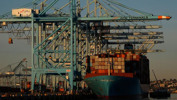 A container ship docked at an ocean port in California.