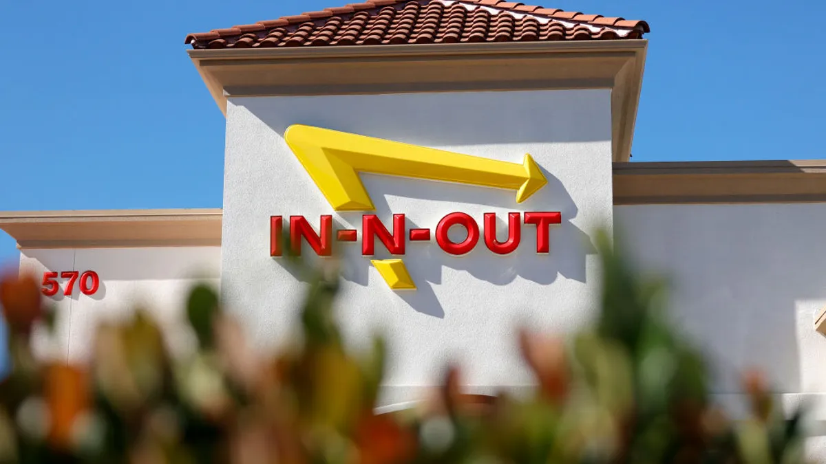 The In-n-Out logo is displayed on the front of an In-n-Out restaurant on October 28, 2021 in Pleasant Hill, California.