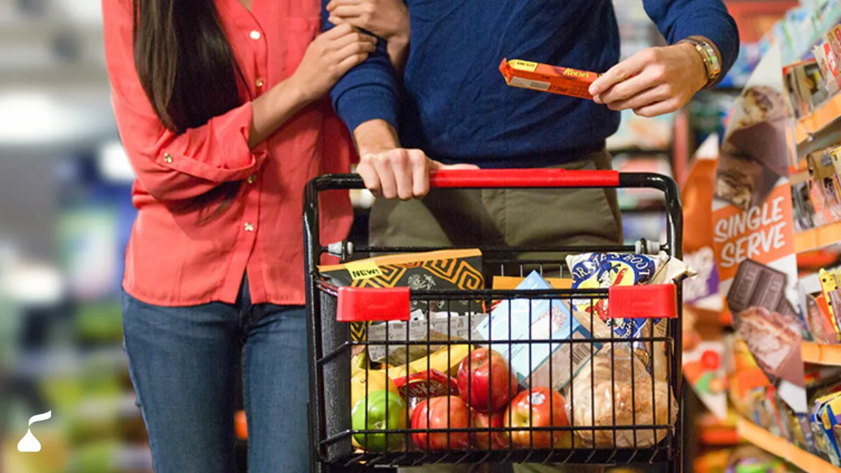 Hershey product being put in a shopping cart.