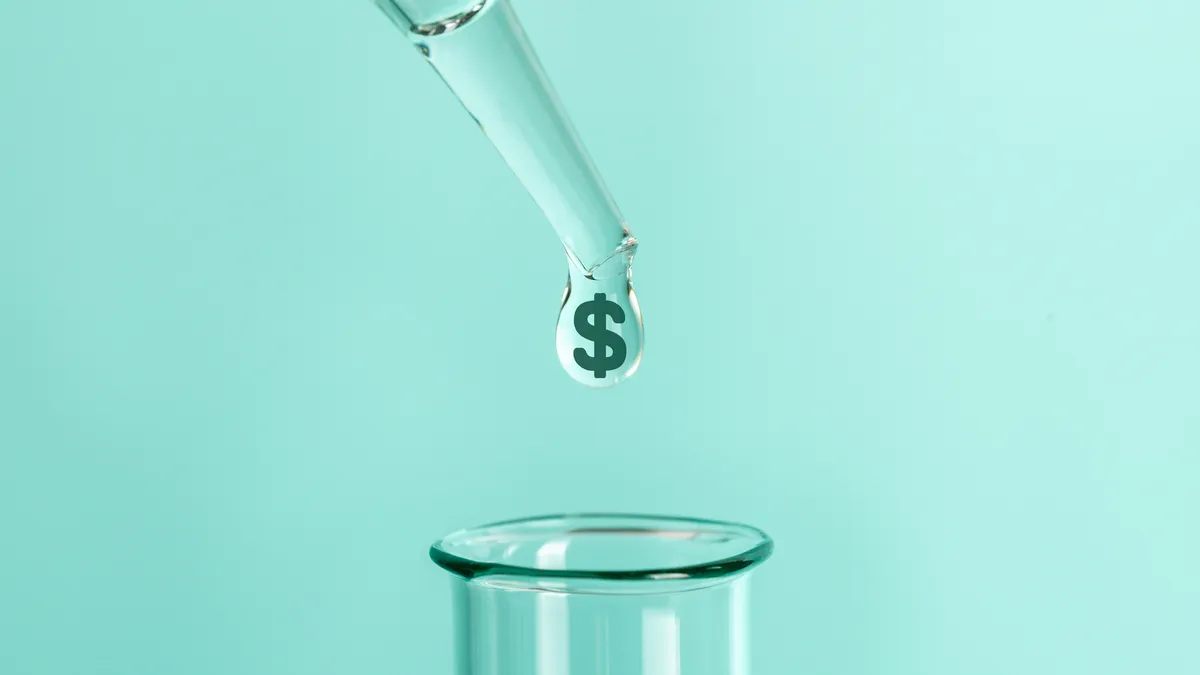 pipette drop with symbol of money dollars into test tube.