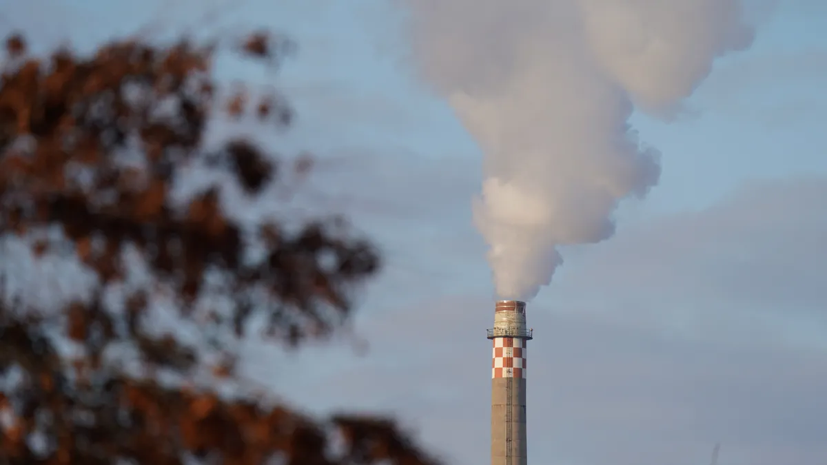 White exhaust plumes from the smokestack of a natural-gas fired power plant.