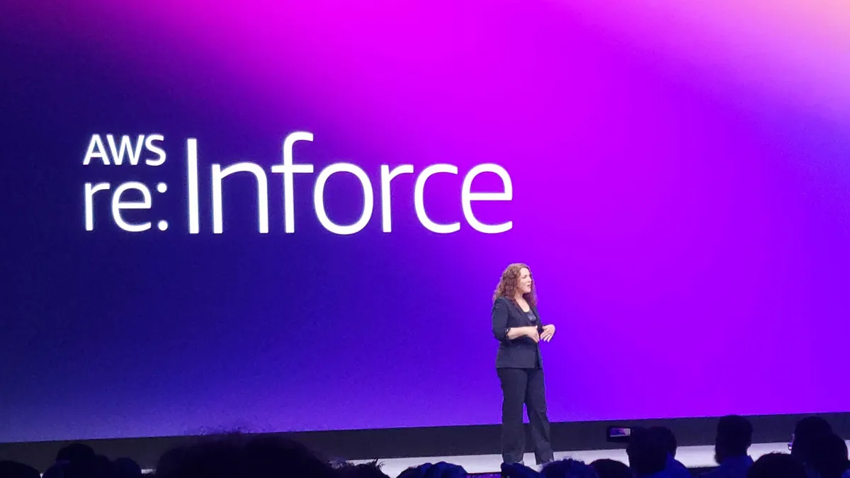 Amy Herzog on stage speaking during a conference