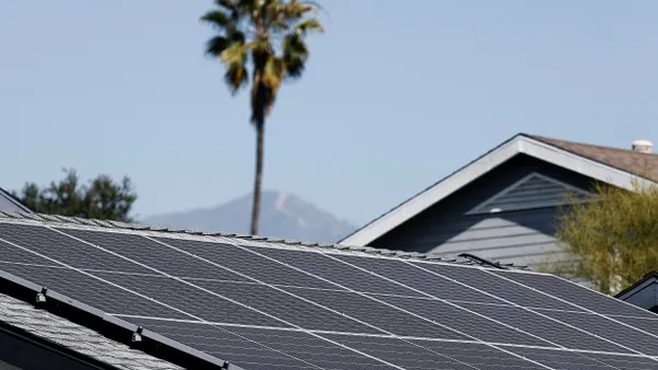 A view of solar panels atop the roof of a home