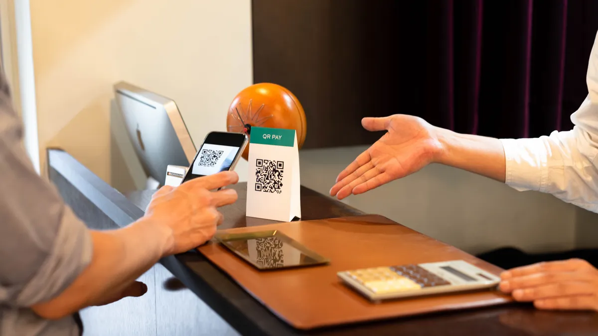 A person scanning a QR code