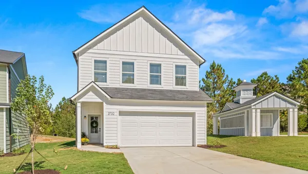 New, white detached home with garage