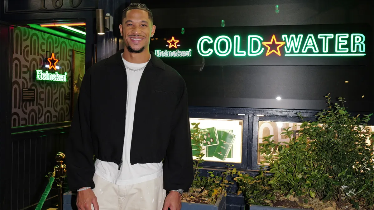 Josh Hart stands in front of the Cold Water Bar.