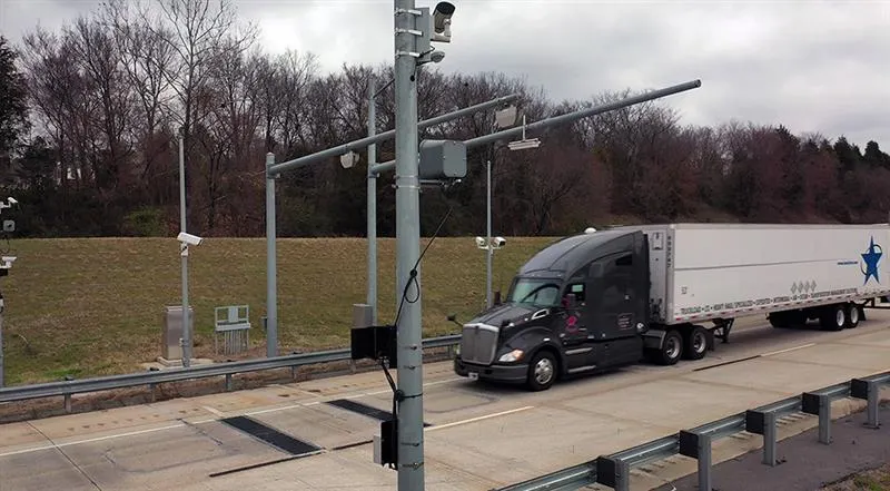 A truck approaching a weight sensor on the highway.