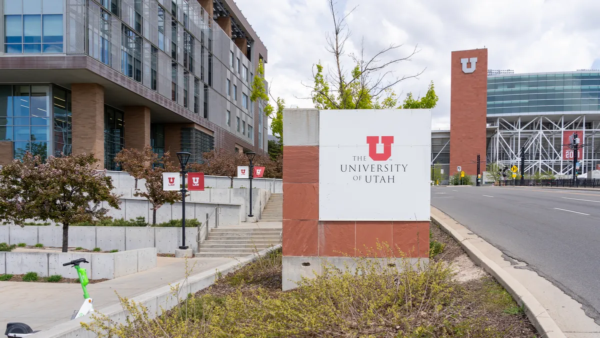A sign on the University of Utah's campus bearing the institution's name.